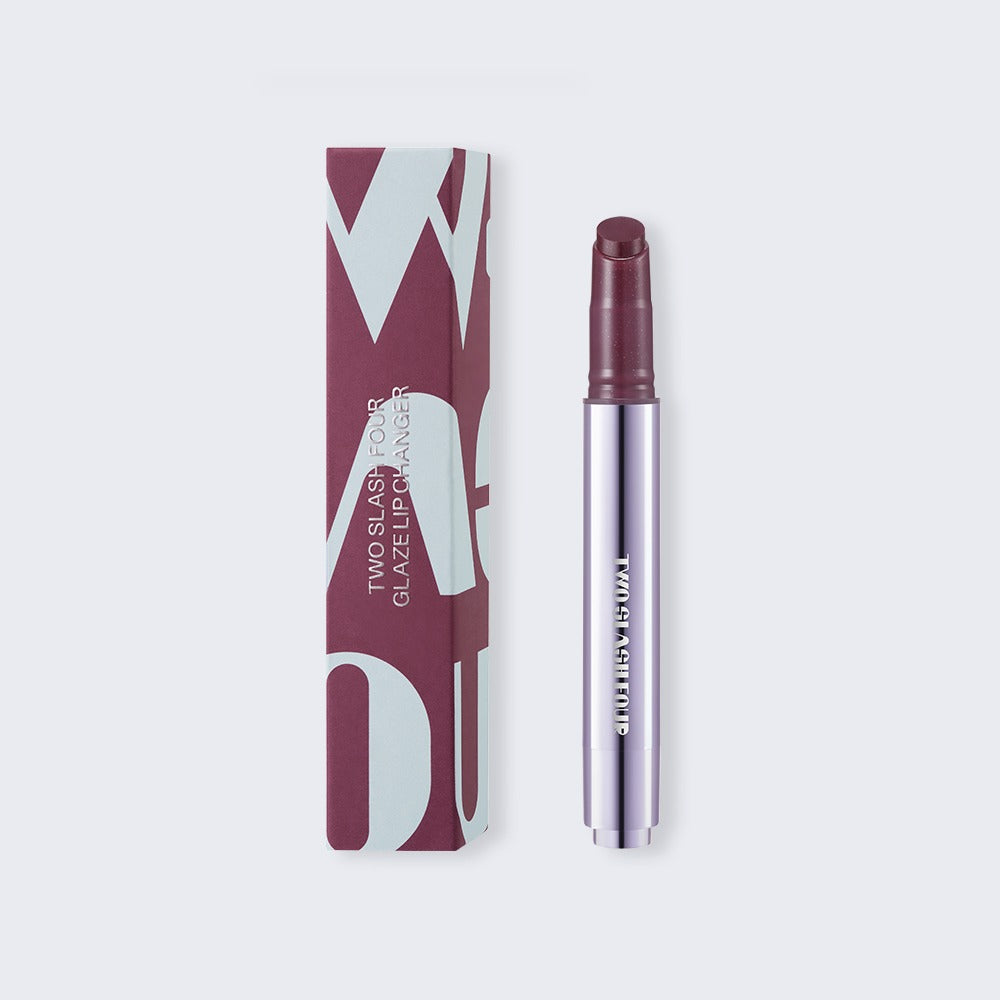 TWO SLASH FOUR Glaze Lip Changer Nu Black Cherry, 2.7g tube with matching carton.