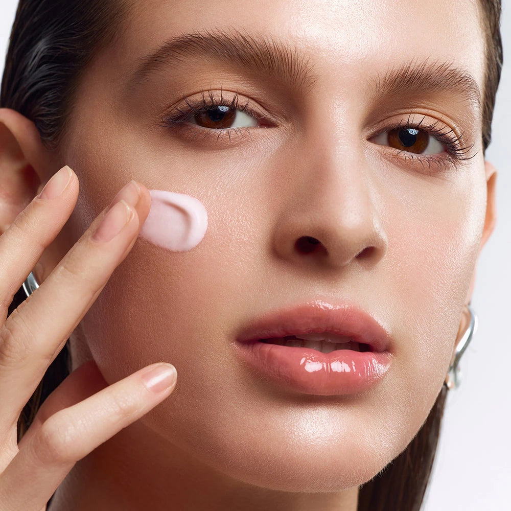 Official Glowy Shell Base pink cream application with a clean fingertip