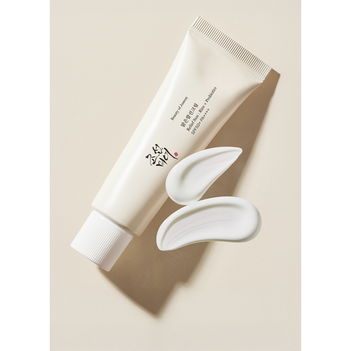 Beauty of Joseon Relief Sun Rice + Probiotics SPF50+ PA++++ 50ml: One original 50ml sunscreen tube beside its cream texture.