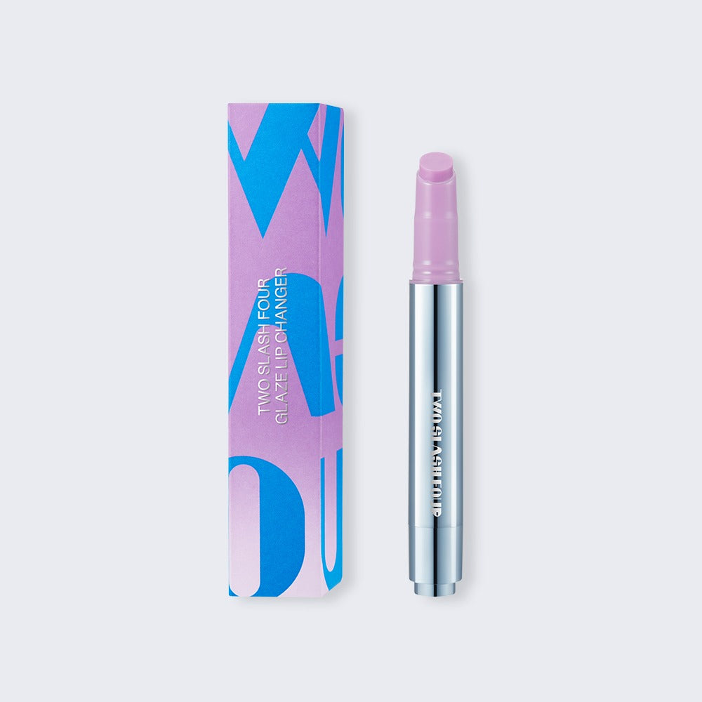 TWO SLASH FOUR Glaze Lip Changer Nu Lavender, 2.7g tube with matching carton.
