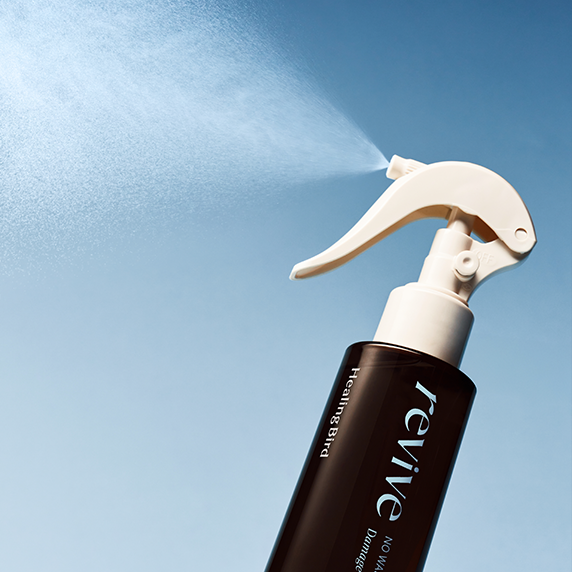 Healing Bird Revive No Wash Treatment Damage Repair, spray application detail.