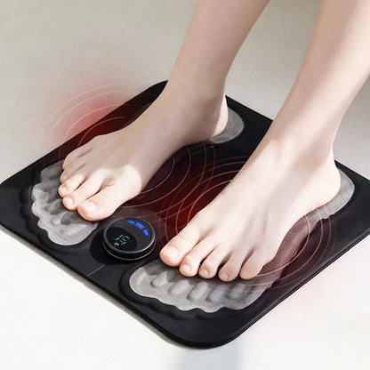 Black bodypim EMS foot massager with bare feet on the shaped pads