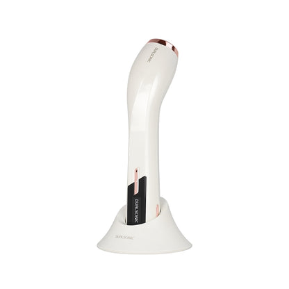 DUALSONIC Maximum White and Rose Gold beauty device on its cradle