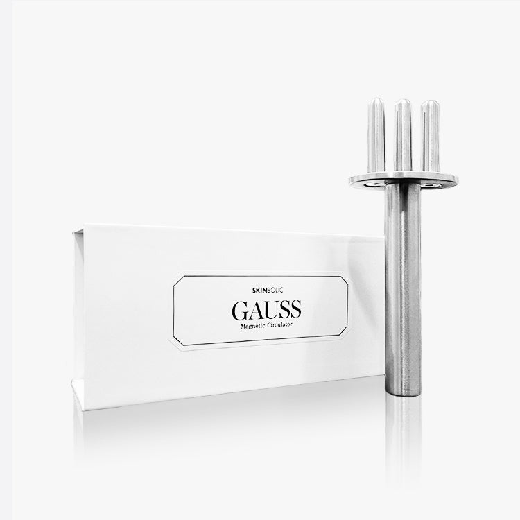 SKINBOLIC GAUSS magnetic massage tool standing beside its product box.