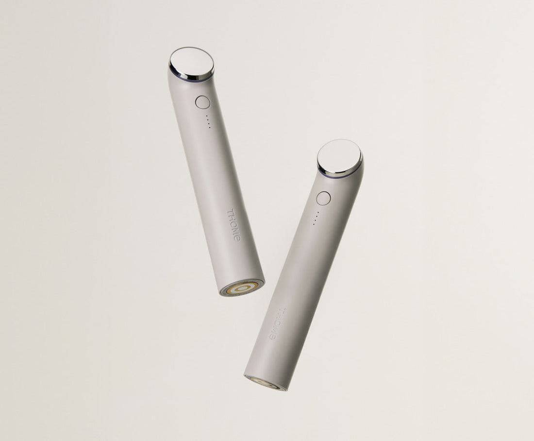 THOME The Glow Basic handheld beauty device, front and rear studio views.