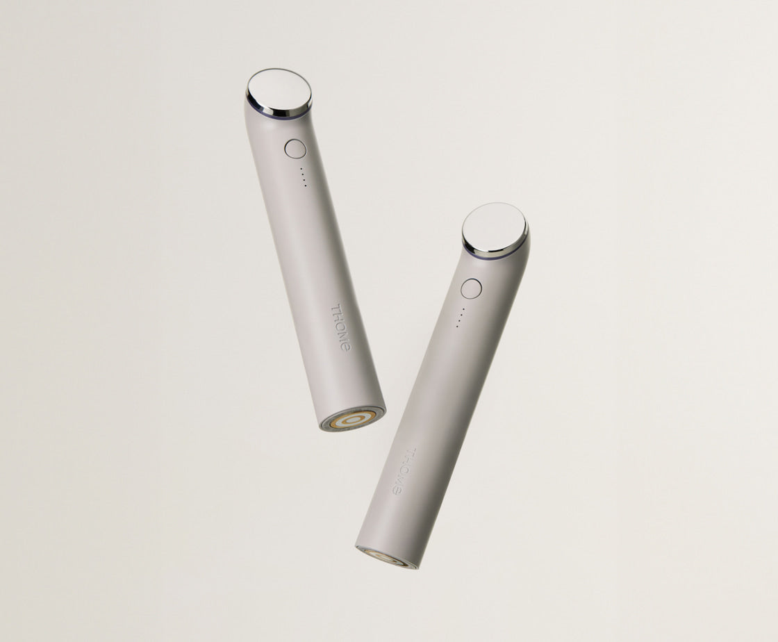 THOME The Glow Basic handheld beauty device, front and rear studio views.