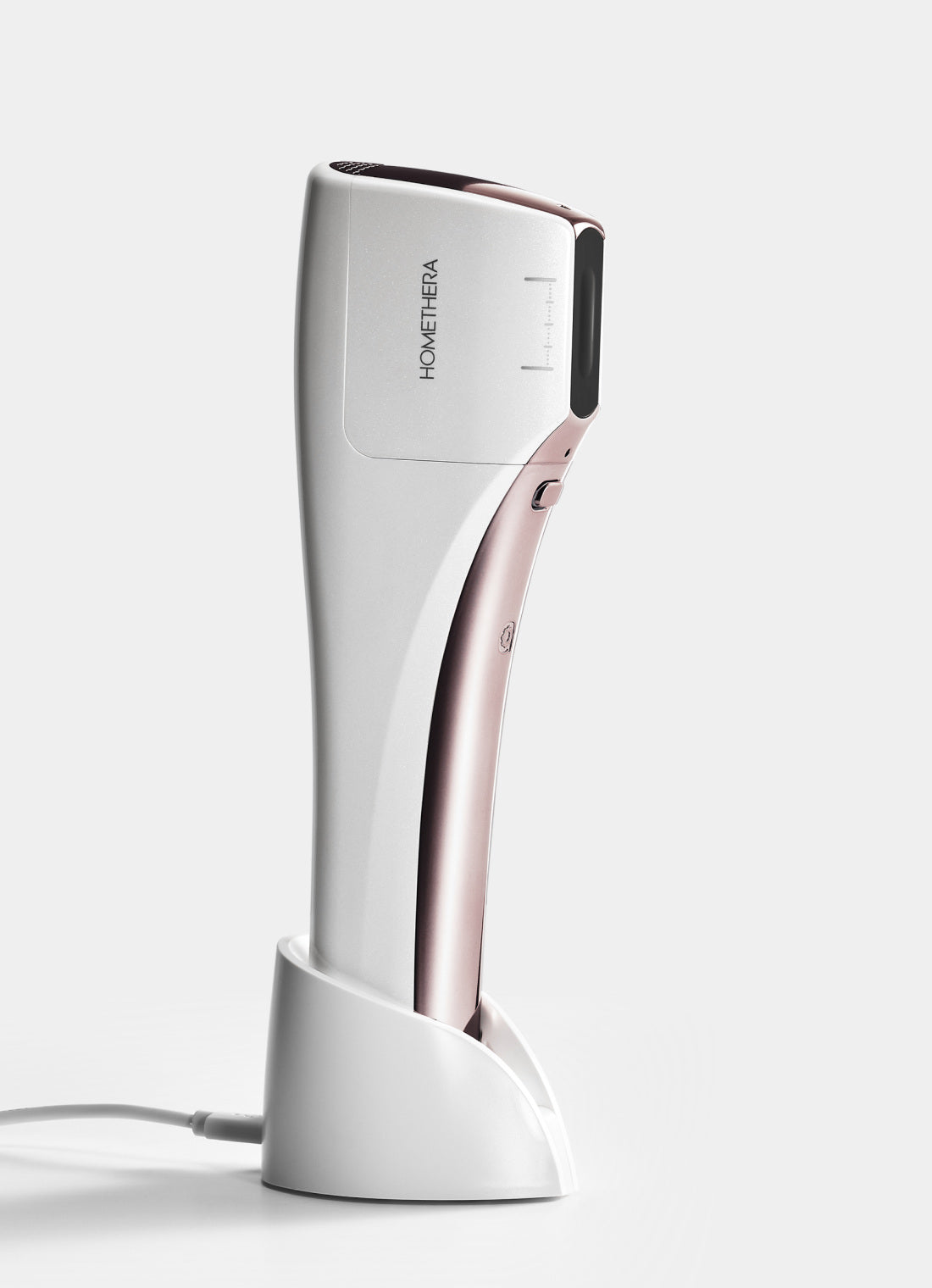 HOMETHERA device with its charging cradle in the manufacturer 2.0-package image.