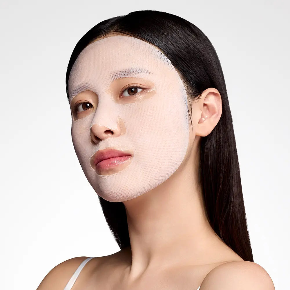 Gauze-style REJUDEX mask fitted over the face