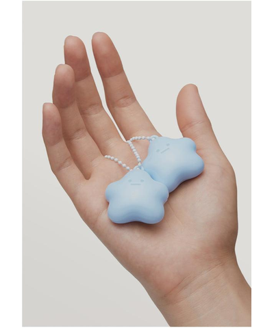 FORMENT original blue Cotton Hugmon perfume balm keychain shown in hand