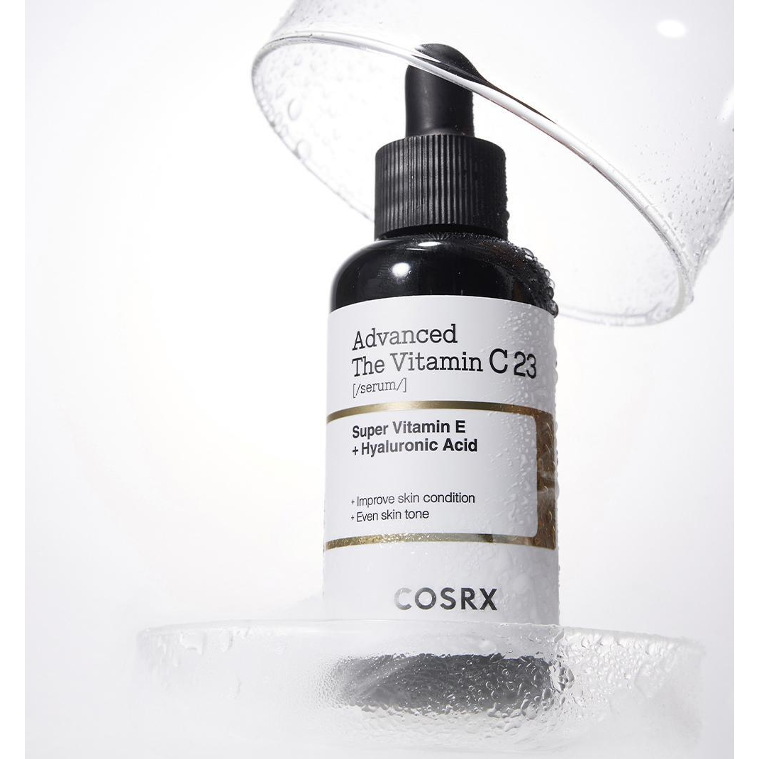 COSRX Advanced The Vitamin C23 Serum, one genuine Advanced formula bottle. Glass props are for styling only.