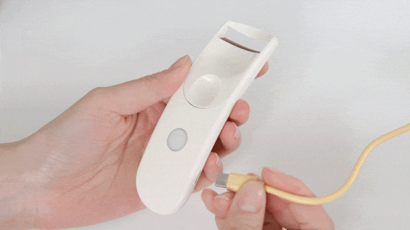 Fillimilli Wide USB heated curler charging with the included cable.
