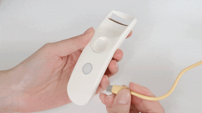 Fillimilli Wide USB heated curler charging with the included cable.
