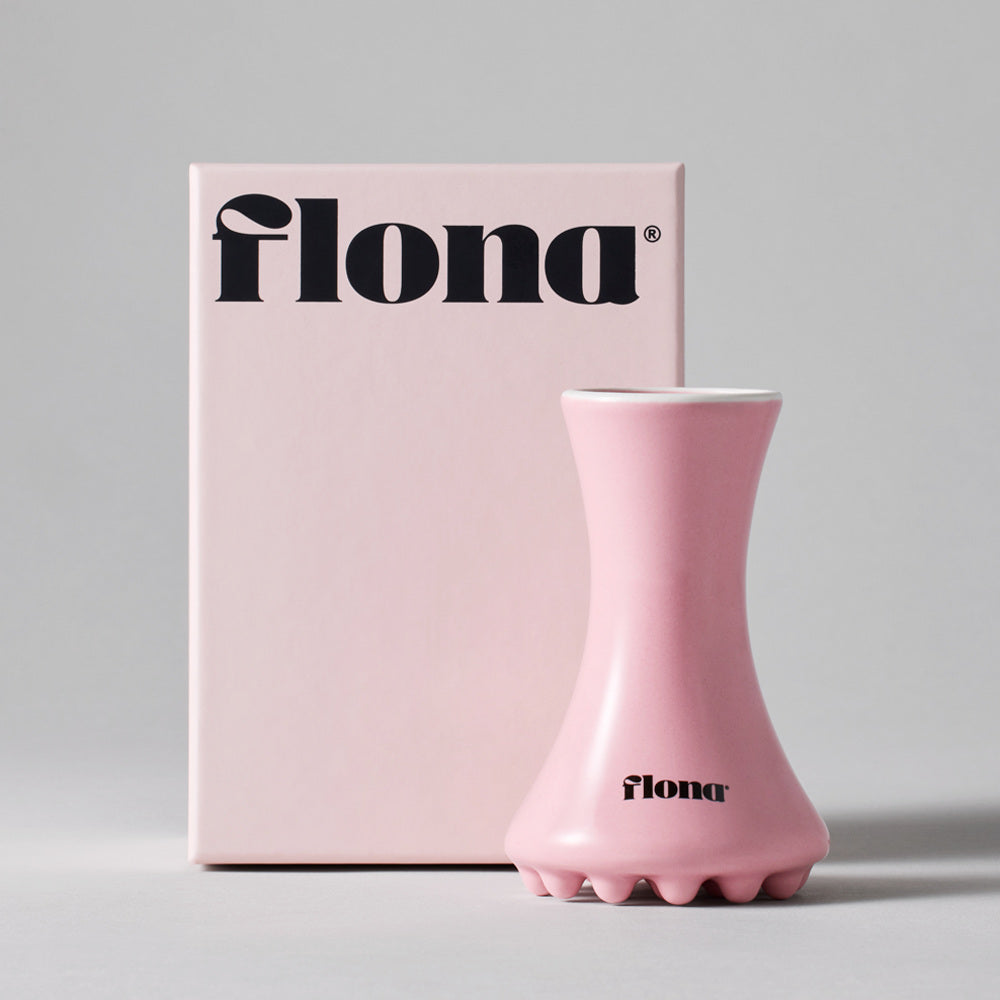 Flona Ceramic Face Gua Sha in Pink with its retail box.