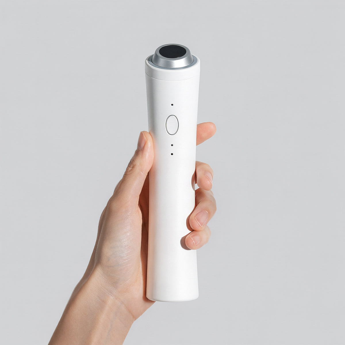P.CALM Clear Pro white PM-01 device with complete body, round treatment head and front button.