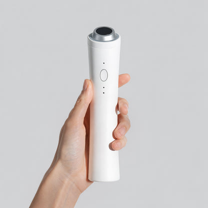 P.CALM Clear Pro white PM-01 device with complete body, round treatment head and front button.