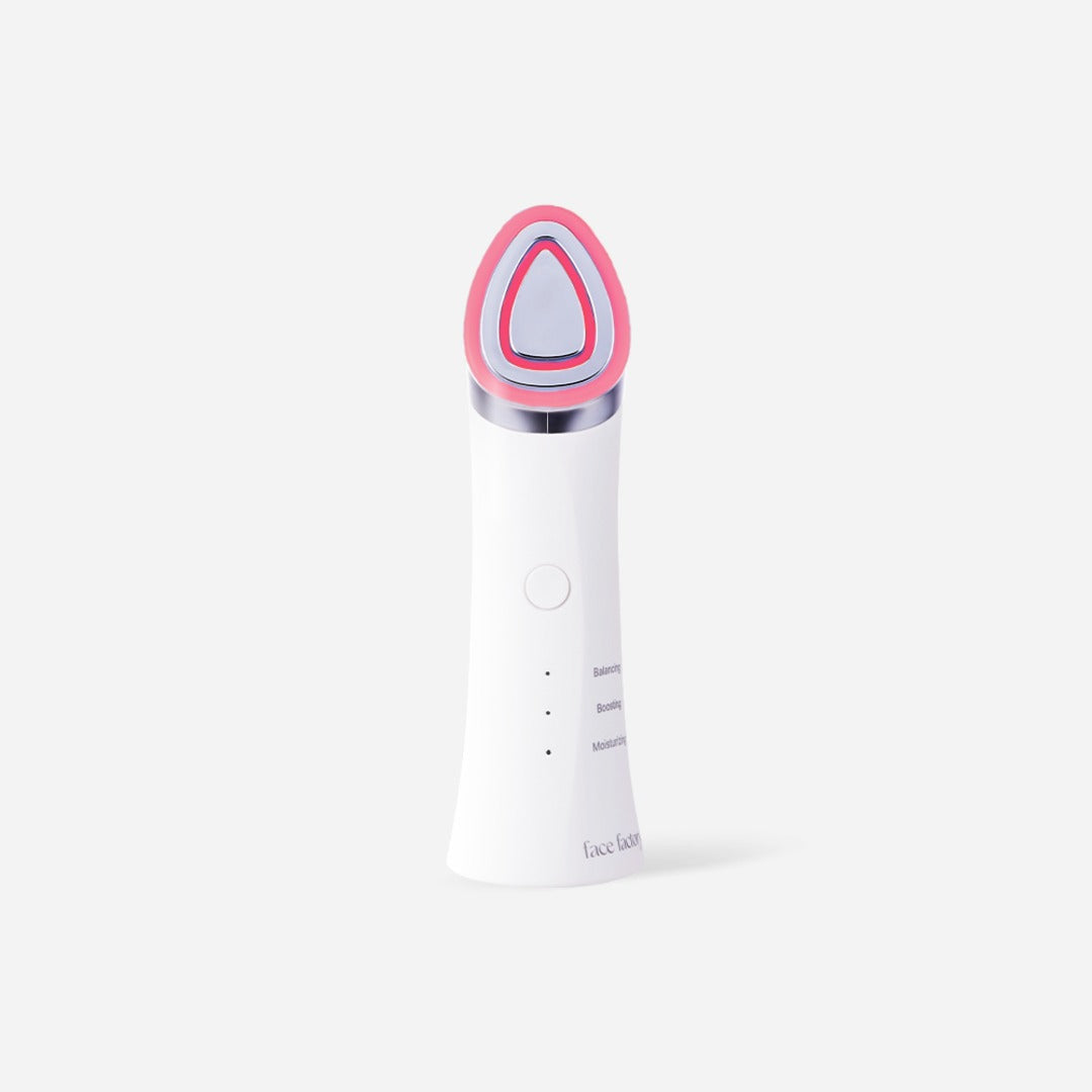 PicoCera Face Factory Boosters Pro FF-28 white device with triangular red-LED treatment head.
