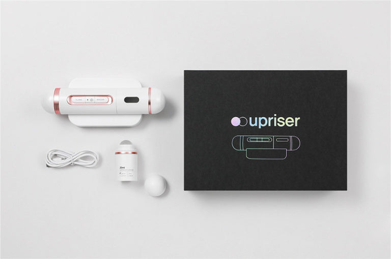 Original PLINIC UPRISER plasma device with stand, empty 25 ml roller, USB-C cable and branded retail box.