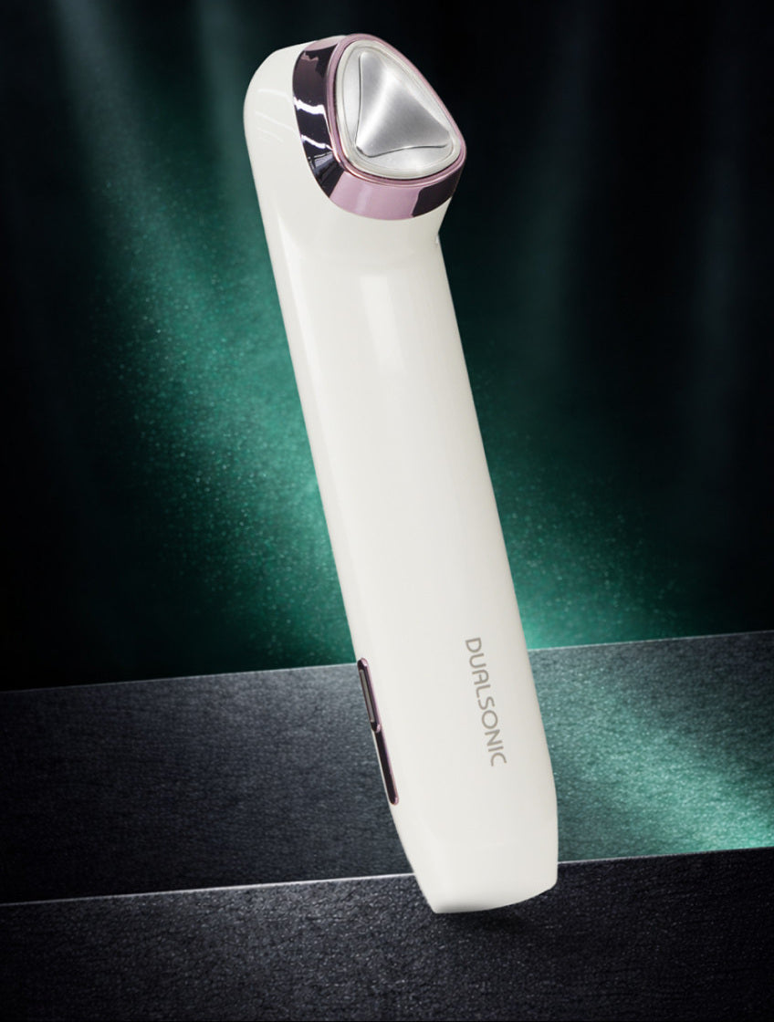 DUALSONIC Glimbit Semo Plus with its triangular treatment head and side controls.