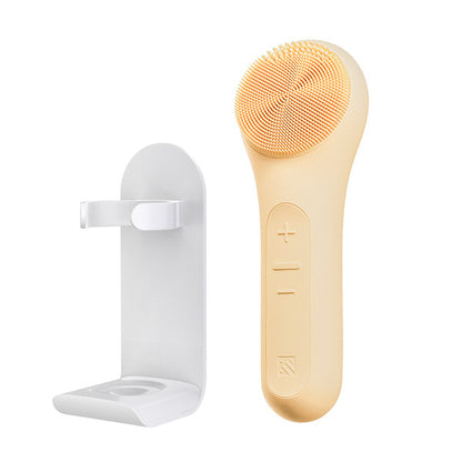 MELIENS ML-31 silicone vibration cleanser in Golden Beige, with its included stand.