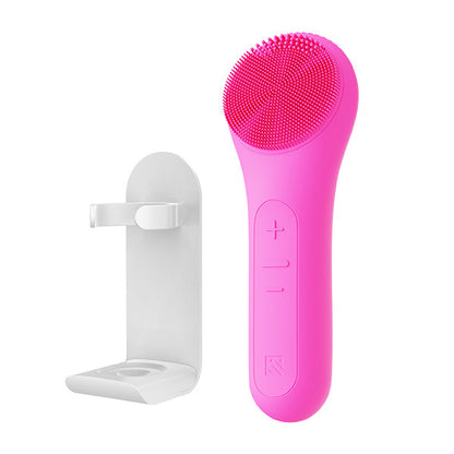 MELIENS ML-31 silicone vibration cleanser in Hot Pink, with its included stand.