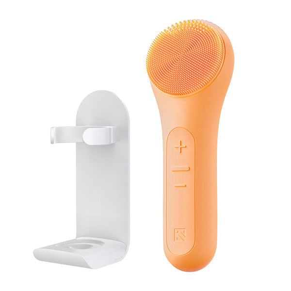 MELIENS ML-31 silicone vibration cleanser in Peach Fuzz, with its included stand.