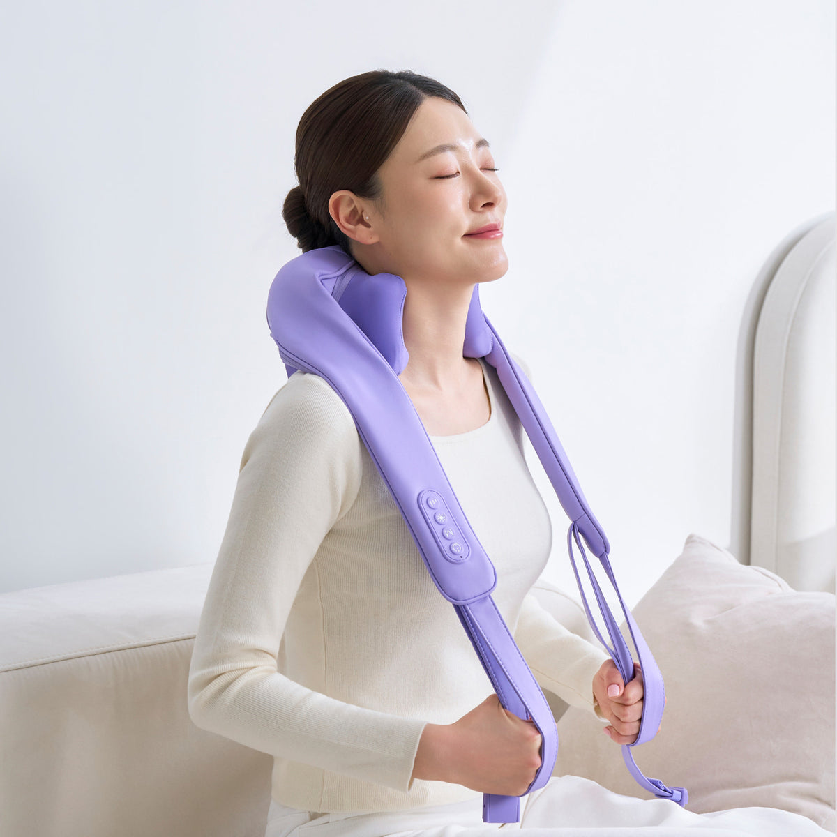 Pulio Neck and Shoulder Lite N002R lavender massager with full straps shown worn on the shoulders