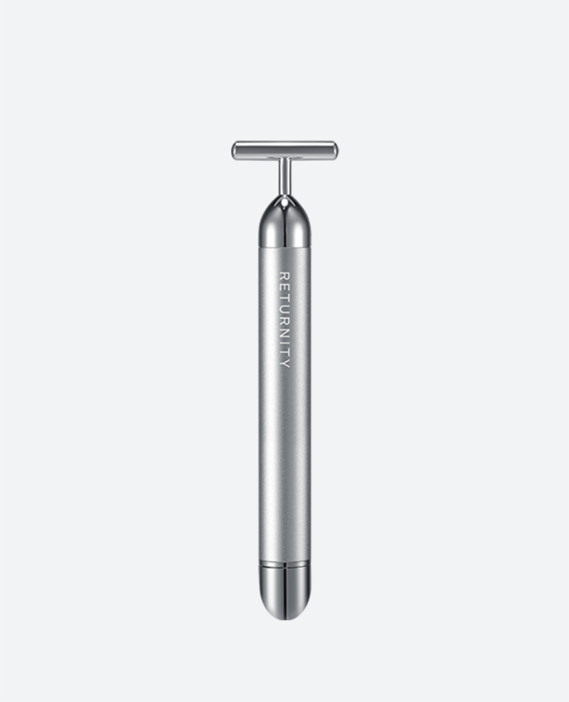 Silver Returnity Massage Booster with its T-shaped head and twist-switch handle.